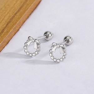Detailed macro view showing S925 hallmark on silver bow screw-back stud earring