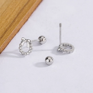 Detailed view of S925 sterling silver bow earrings with secure screw-back closure
