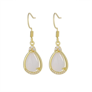Close-up of teardrop chalcedony earrings with gold hooks and sparkling zircon accents