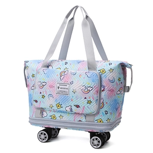 Light blue quilted travel bag with unicorn patterns and 360-degree swivel wheels