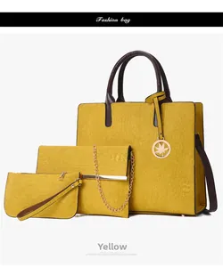 Detailed three-piece set with yellow tote bag, chain envelope pouch and coin purse
