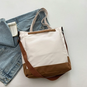 Minimalist cream and brown tote bag with adjustable shoulder strap and large capacity
