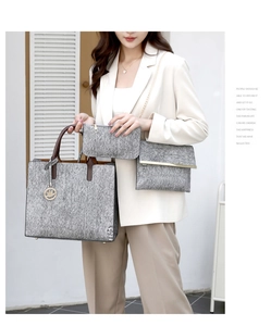 Three-piece grey tote bag set with brown handles and a gold-detail envelope clutch