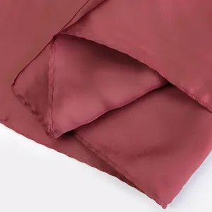 Elegant dark red square silk scarf with smooth satin finish and premium hemmed edges