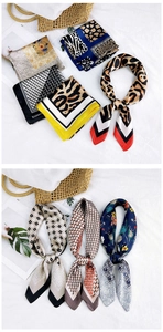 Detail of silk-like square scarves with leopard and floral prints on textured background