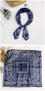 Flat lay and styled view of navy blue paisley silk scarf with floral pattern border