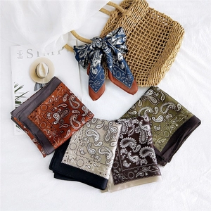 Set of five paisley patterned silk scarves with astronomical sun and star motifs