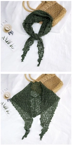 Close-up of forest green lace triangle scarf with hollow floral crochet patterns