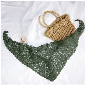 Detailed close-up of dark green floral lace triangular scarf with scalloped edges