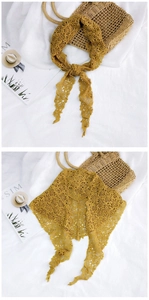 Detail of mustard yellow lace triangle scarf with intricate hollow floral crochet patterns