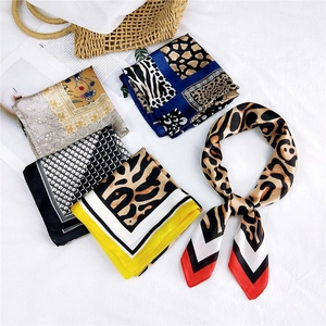 Silk square scarf assortment with leopard and floral prints on a white background
