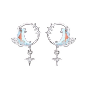 Silver celestial earrings featuring blue iridescent moon and sparkling star zircon