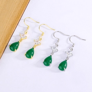 Detailed view of teardrop green chalcedony earrings in gold and silver finish
