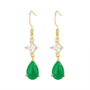 Detailed close-up of teardrop green chalcedony earrings with golden hooks and zircon stones