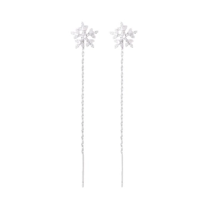 Silver snowflake threader earrings with long tassel and zircon stud on white background