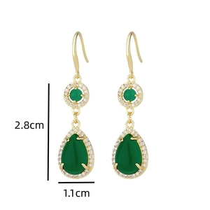 Detailed view of vintage drop earrings with green stones and dimensions 2.8cm by 1.1cm