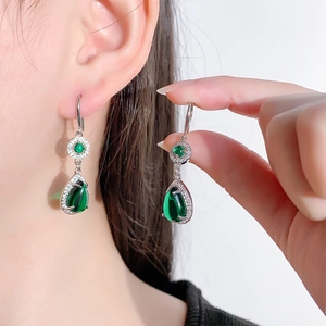 Vintage pear-cut emerald drop earrings with sparkling zircon accents in silver setting