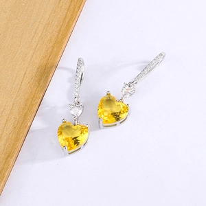 Elegant heart-shaped drop earrings with yellow zircon and sparkling silver ear hooks