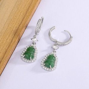 Detailed close-up of green chalcedony hulu earrings with sparkling zircon and S925 stamp