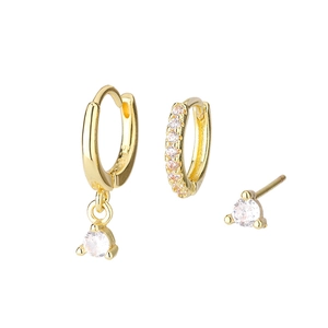 Macro shot of S925 sterling silver stamp and zirconia stones on gold geometric earring set