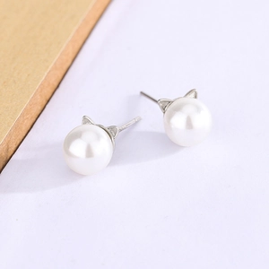 Detailed macro view of S925 silver cat ear pearl studs with minimalist design