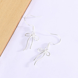 Elegant silver bow ribbon drop hook earrings with a polished metallic finish for women