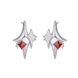 Star-shaped earrings in silver finish with red zircon stone and small white crystals