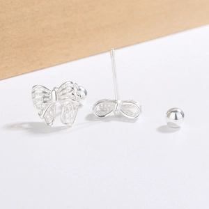 Silver bow knot stud earrings with hollow woven design and screw back ball closure