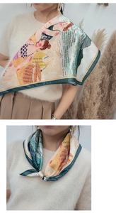 Detailed view of digital print silk scarf styled as a versatile neckerchief and shawl