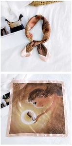 Close-up of printed silk square scarf with soft illustration and premium hemmed edge