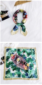 Detailed view of square silk scarf featuring artistic pond illustration and hand-drawn patterns