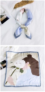 Detail of square silk scarf showing vintage floral print with woman holding hydrangeas