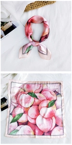 Detail of square silk scarf with peach print and elegant dark gray border for styling