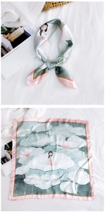 Detailed view of square silk scarf featuring artistic girl on lotus pond illustration
