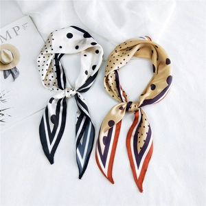 Elegant diamond-shaped silk scarf with polka dots and stripes in black and yellow