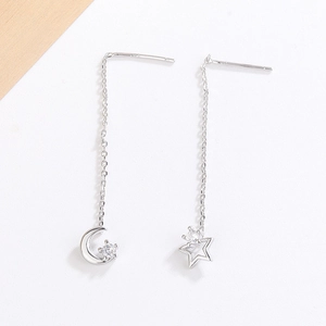 Macro shot of S925 sterling silver stamp on asymmetrical star and moon tassel earrings