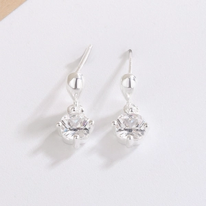 Detail of square zircon drop earrings with silver four-prong setting and water drop stud
