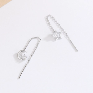 Silver star and moon tassel threader earrings with cubic zirconia in a minimalist style