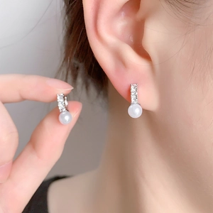 Elegant 14K gold plated earrings featuring round white pearls and sparkling zircons