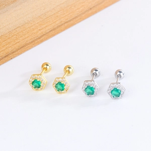Detail of emerald green zircon stud earrings in gold and silver with screw back closure
