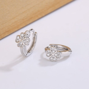 Minimalist four-leaf clover hoop earrings with zircon pavé in a polished silver finish