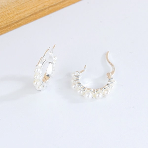 Elegant S925 silver hoop earrings featuring micro-pave white pearls in a minimalist design