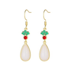 Detail of traditional Chinese earrings with green enamel clouds and white teardrop drop