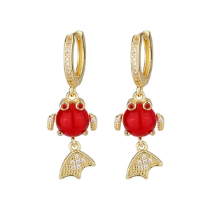 Macro detail of koi goldfish earrings with red enamel beads and sparkling zircon stones