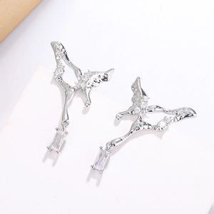 Detail of silver liquid butterfly earrings with sparkling cubic zirconia insets