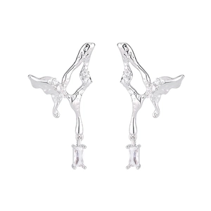 Detailed macro view of silver liquid butterfly earrings with sparkling cubic zirconia drops