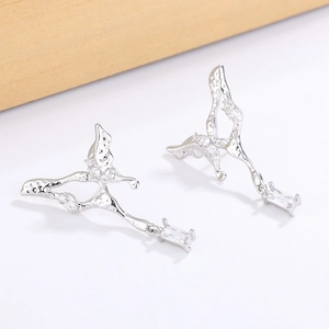 Abstract silver butterfly tassel earrings with liquid lava texture and sparkling zircons