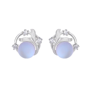 Detailed macro view of silver fishtail stud earrings with sea salt blue beads and zircon