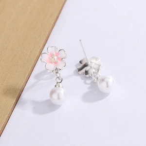 Elegant cherry blossom earrings with pink enamel finish and dangling white pearl drops