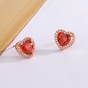 Elegant heart-shaped red zircon stud earrings with crystal halo in rose gold plating